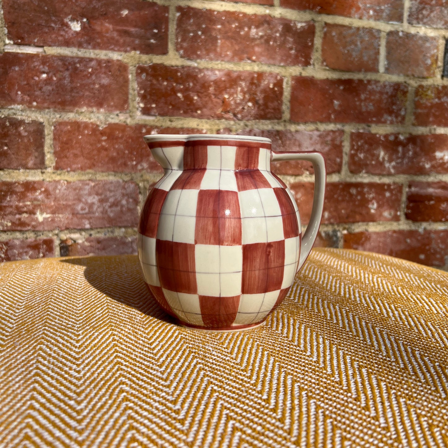 Checkered ceramic pitcher