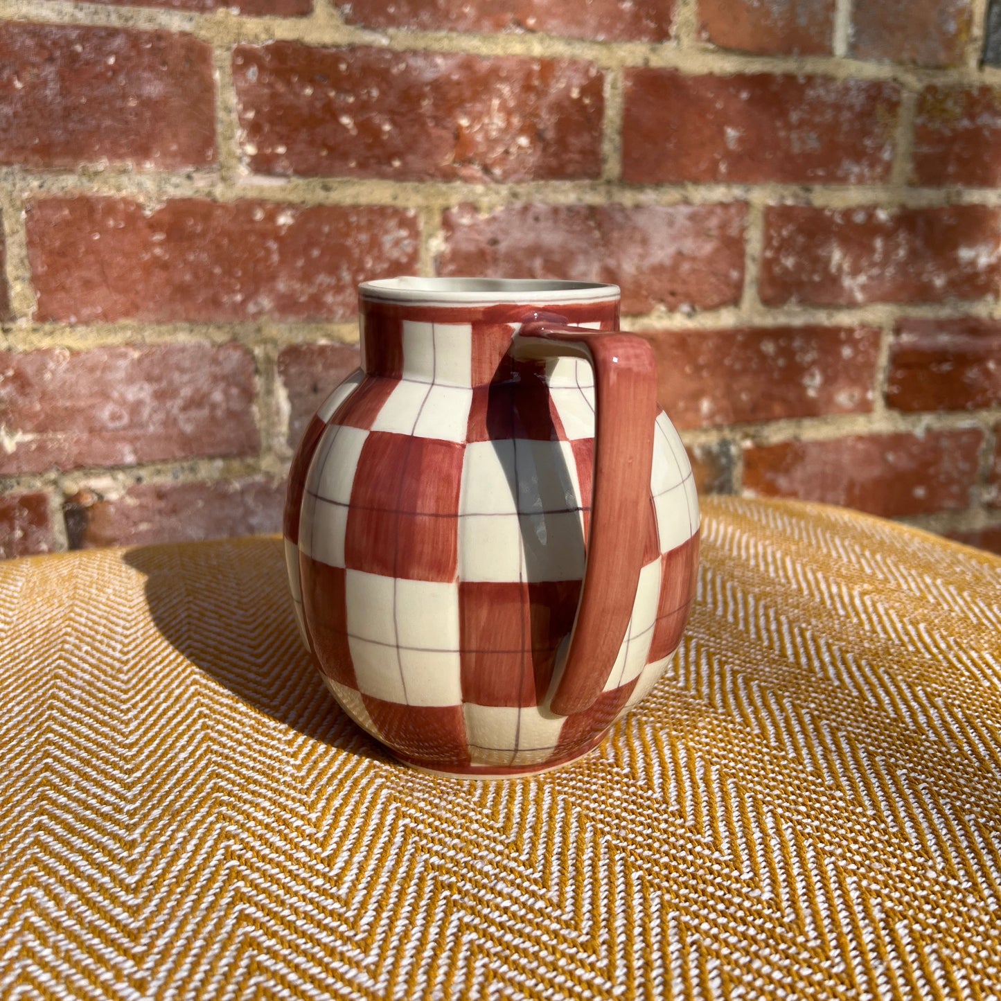 Checkered ceramic pitcher