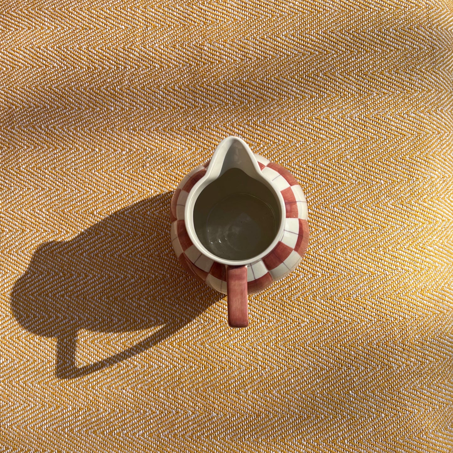 Checkered ceramic pitcher