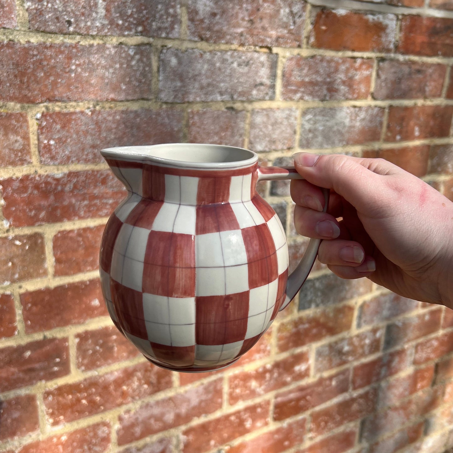 Checkered ceramic pitcher