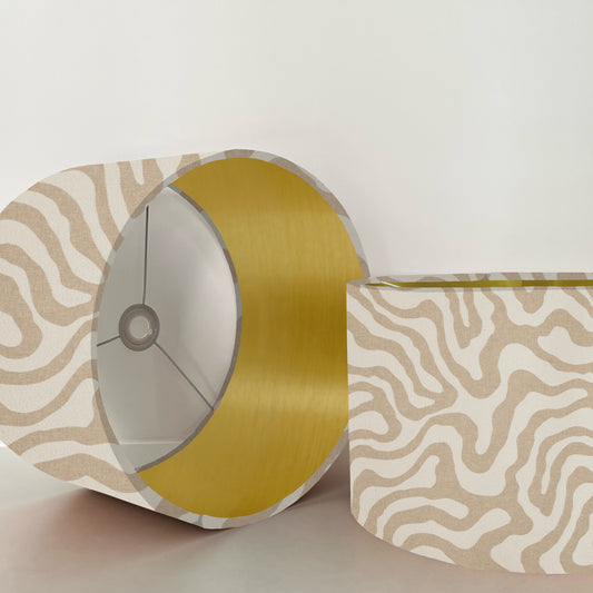 Ecru wiggle drum lampshade/ ceiling shade with a metallic brushed gold lining